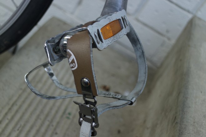 Toe clips of course, ride in any shoe you like.